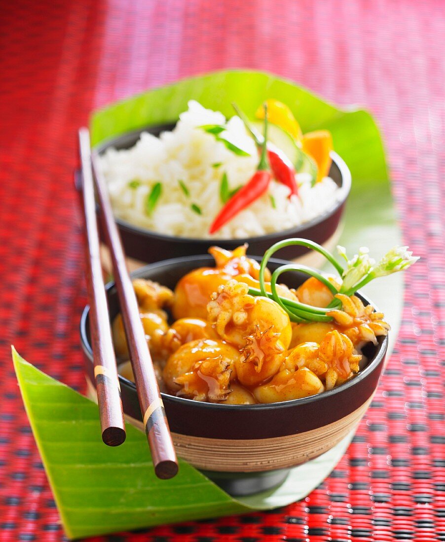 Calamaries in sweet and sour sauce, rice with spicy hot peppers