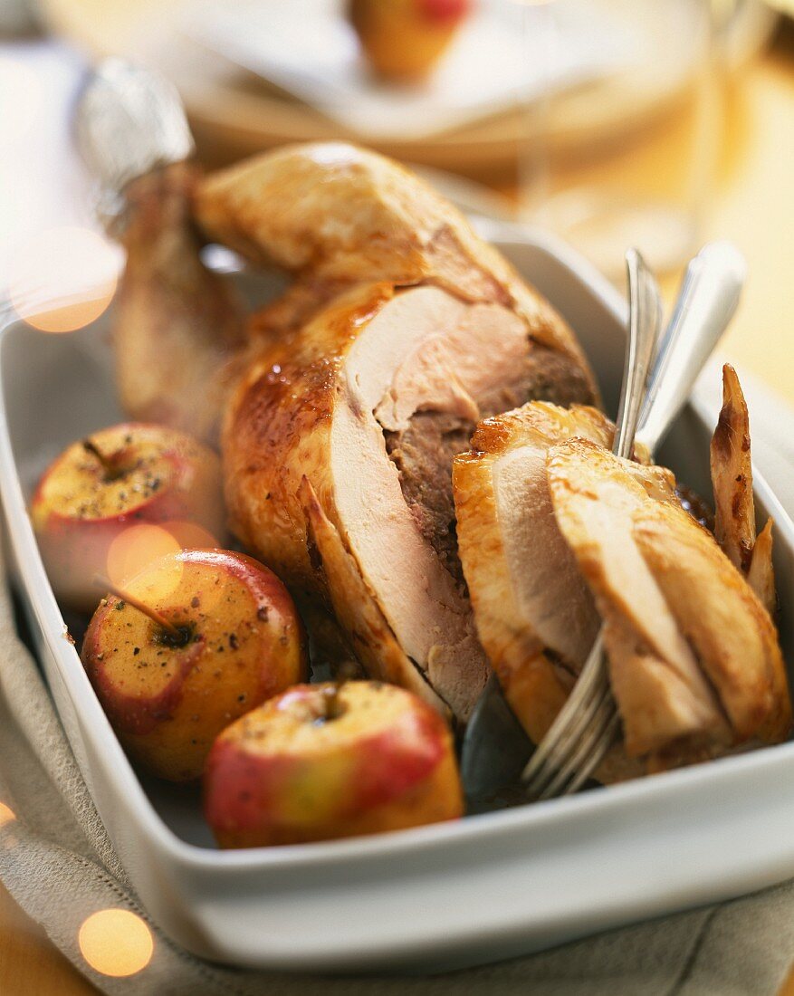 Roast capon with stuffing and apples