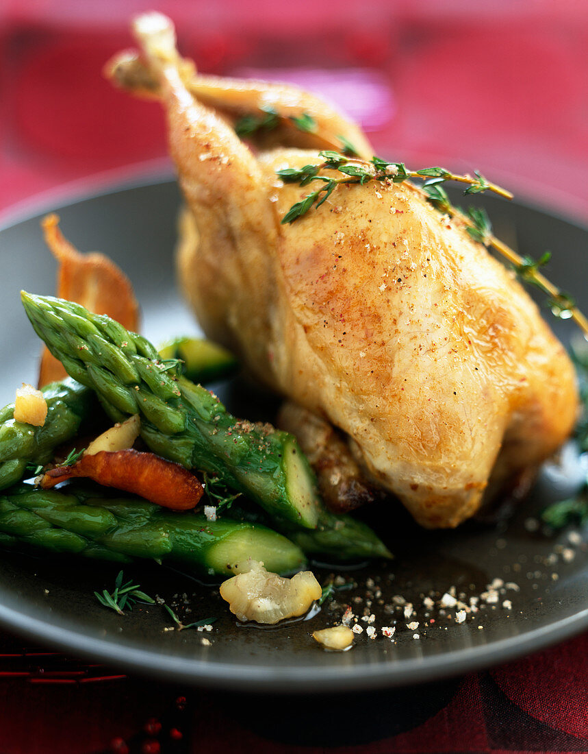 Stuffed quail with green asparagus