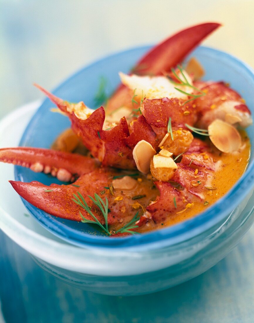 Lobster soup with curry and dried fruit