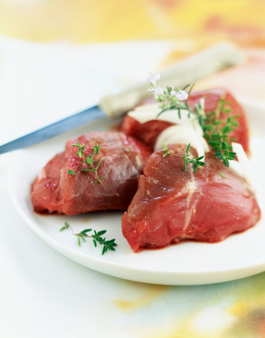 Raw thick pieces of saddle of lamb