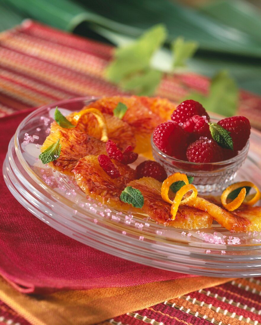 Orange fruit salad with raspberries