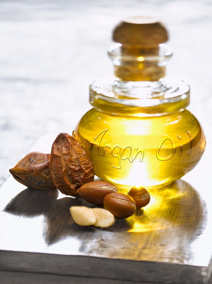 Bottle of argan oil and argan nuts
