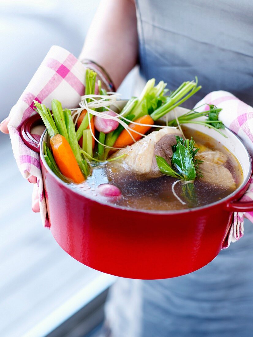 Stringed roast beef with vegetables in a casserole dish