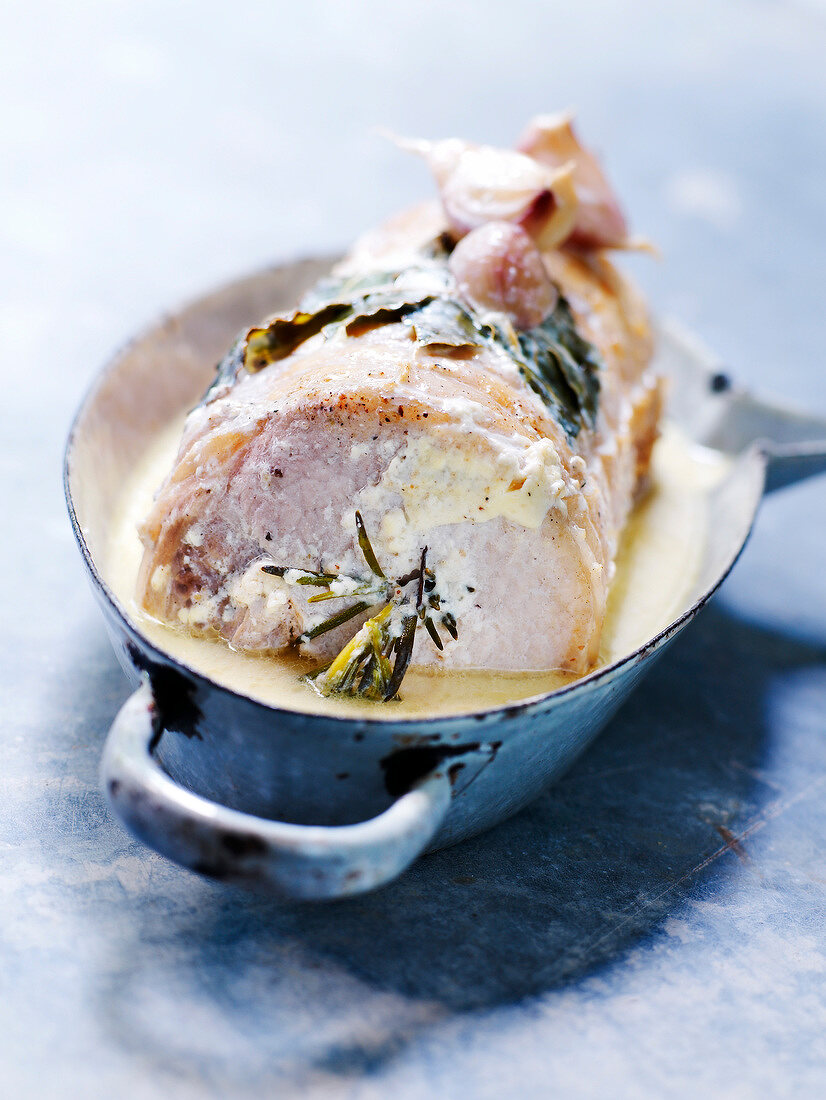 Roast pork with milk sauce and rosemary