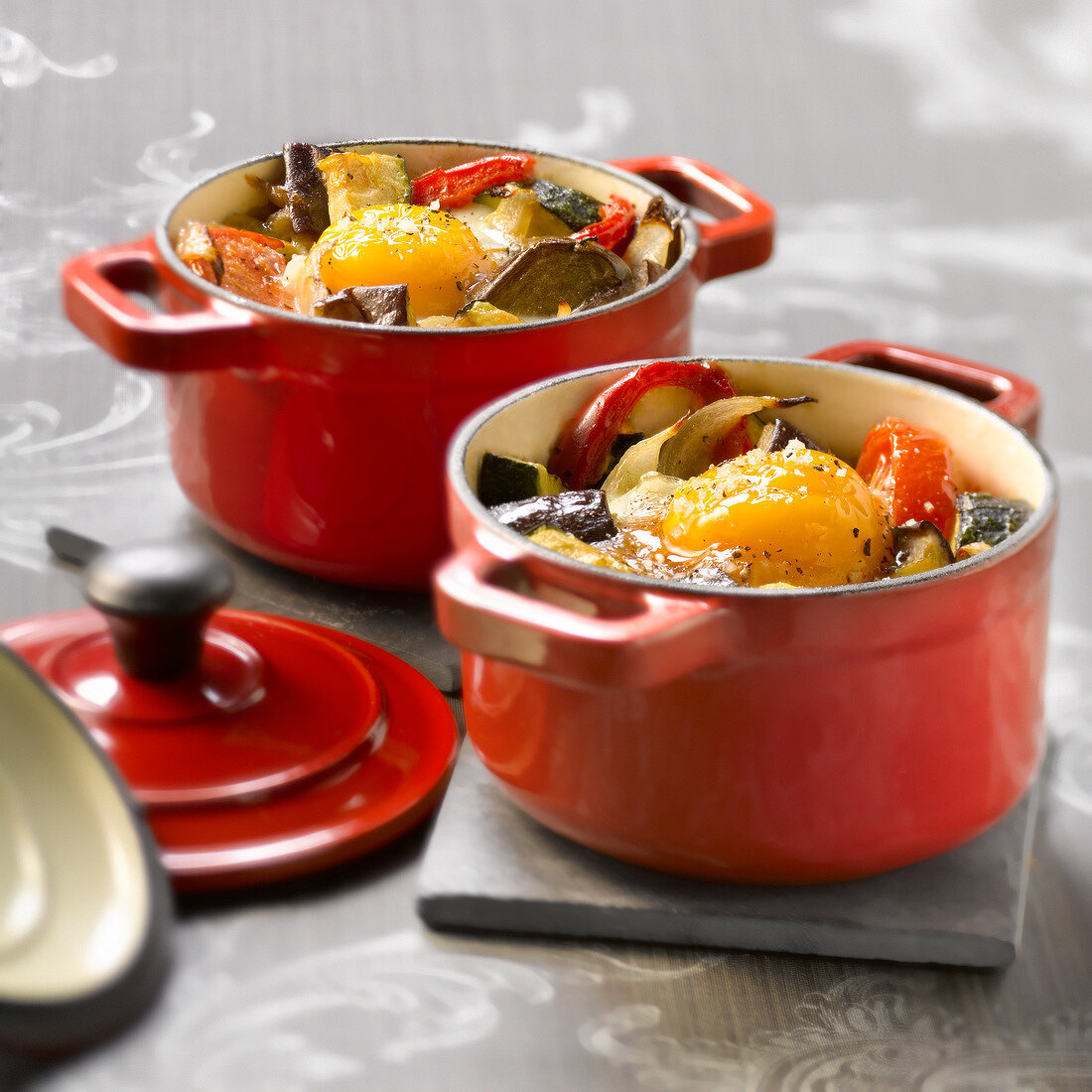 Small casserole dish of ratatouille with an egg