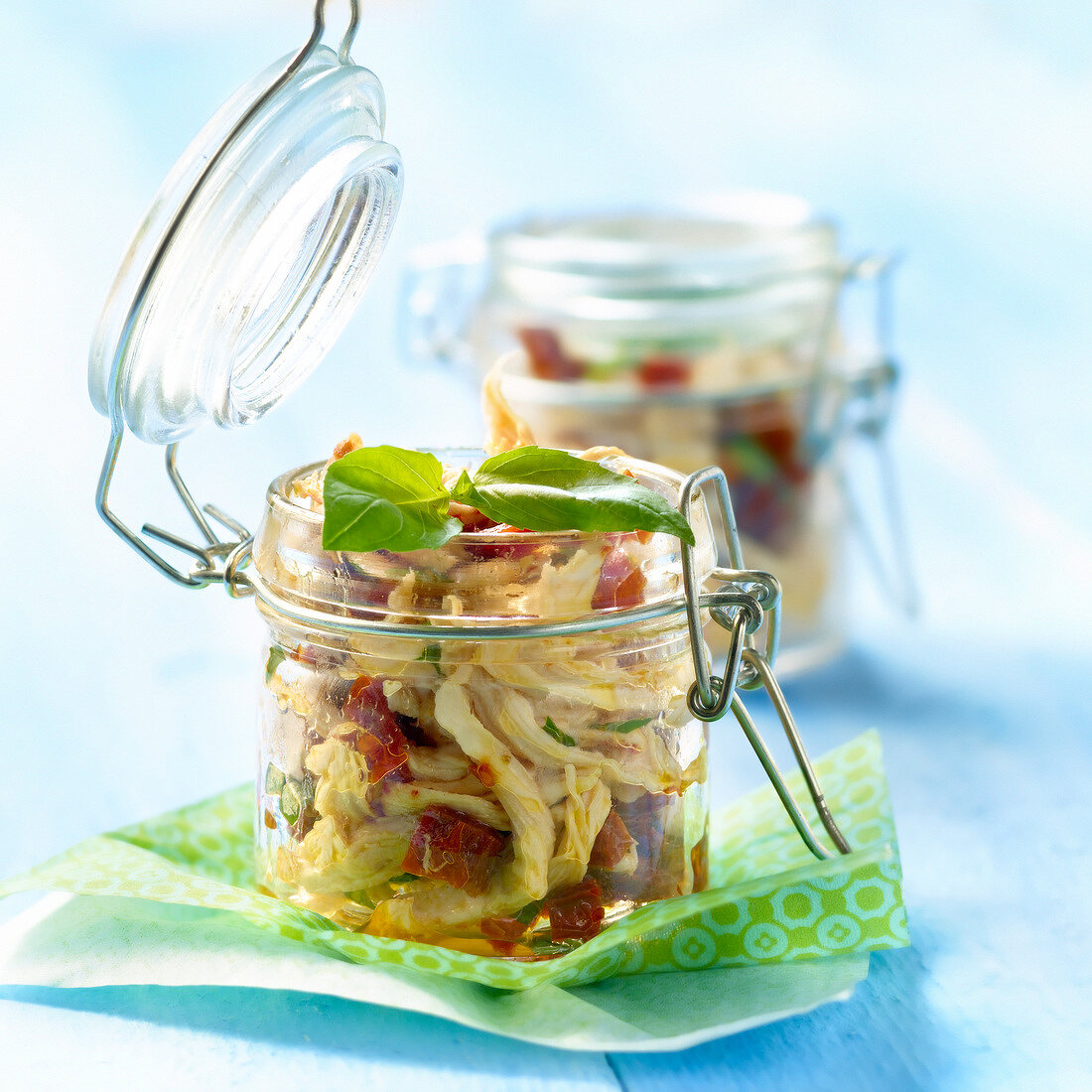 Flaked chicken with preserved tomatoes and basil