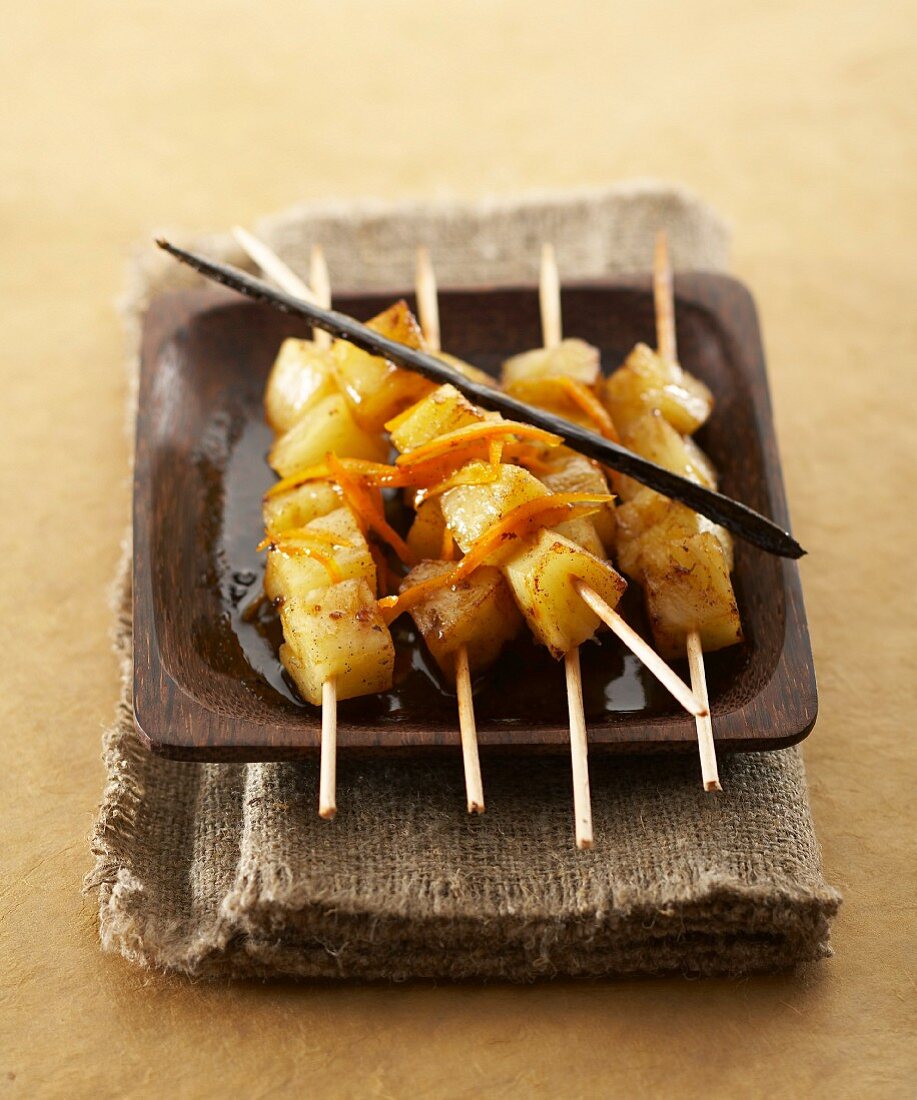 Pineapple brochettes with sweet wine syrup