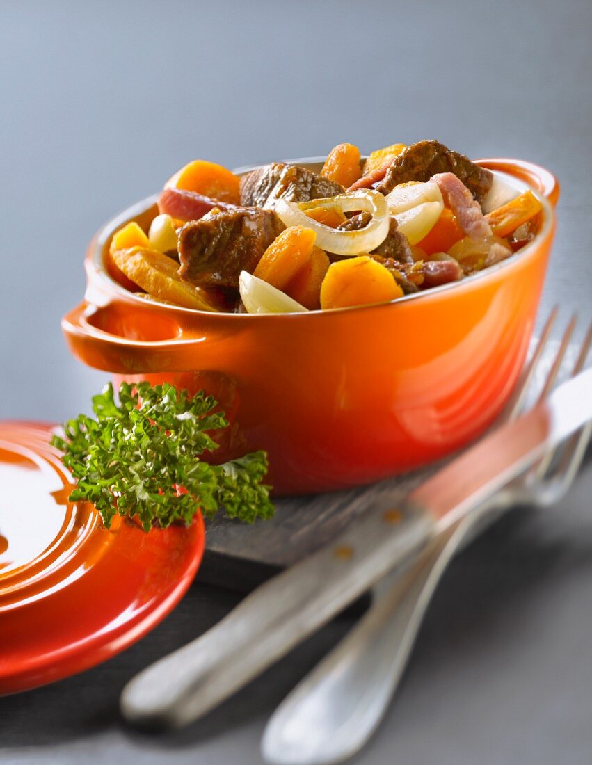 Casserole dish of beef and carrot stew