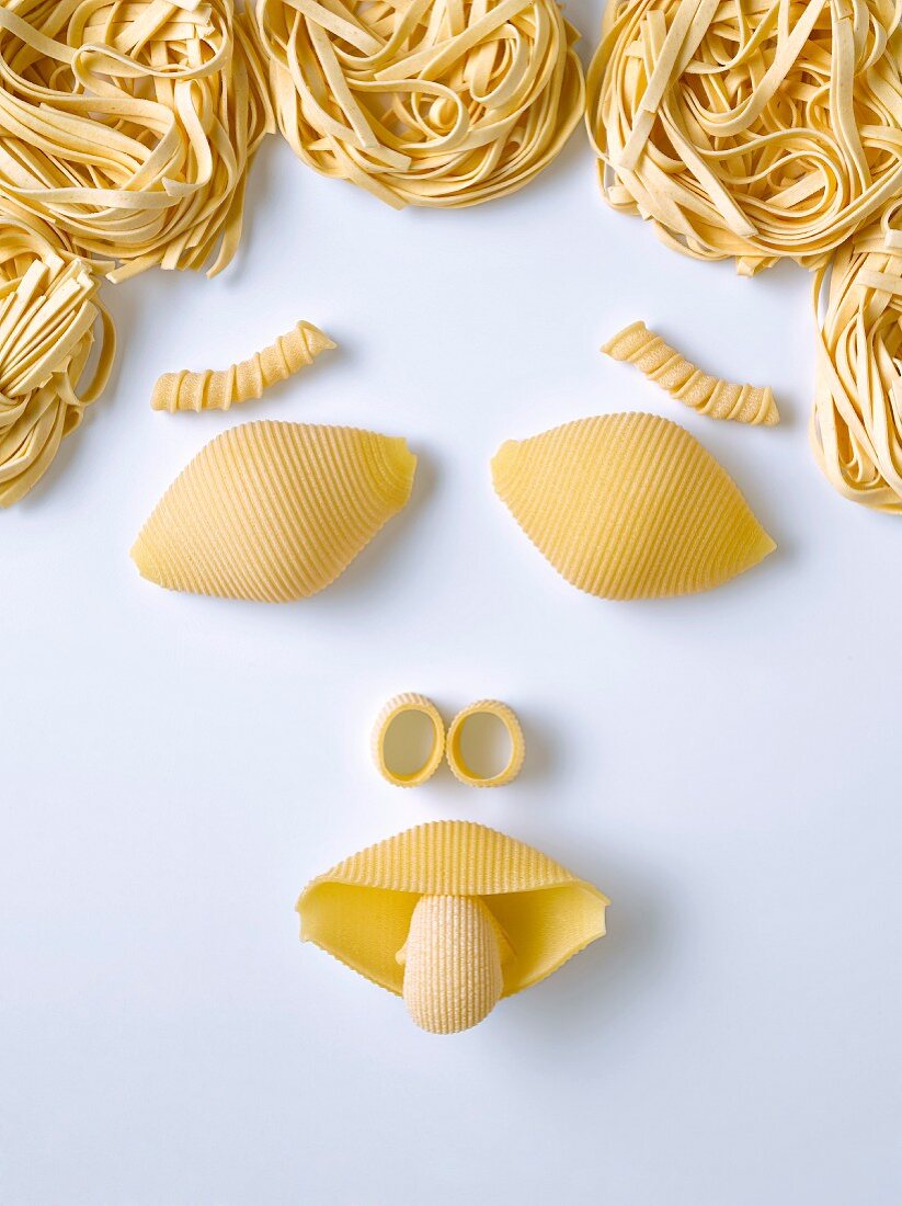 Pasta in the shape of a face – License Images – 60160216 ❘ StockFood