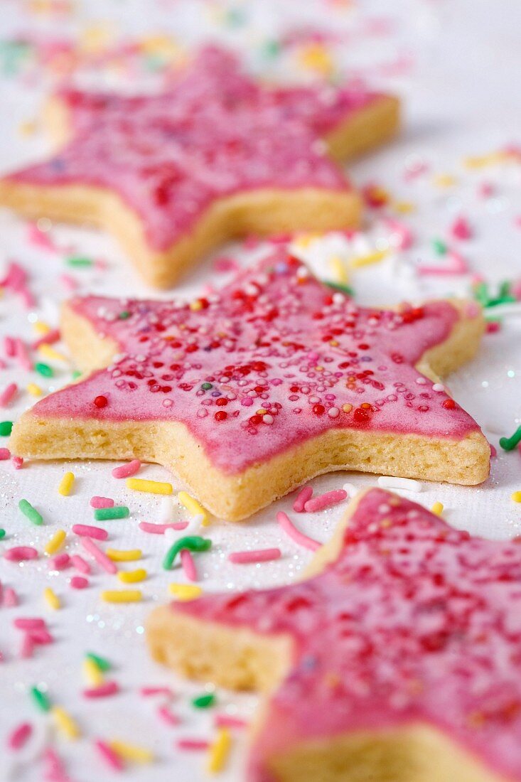 Star-shaped shortbread cookies with pink icing