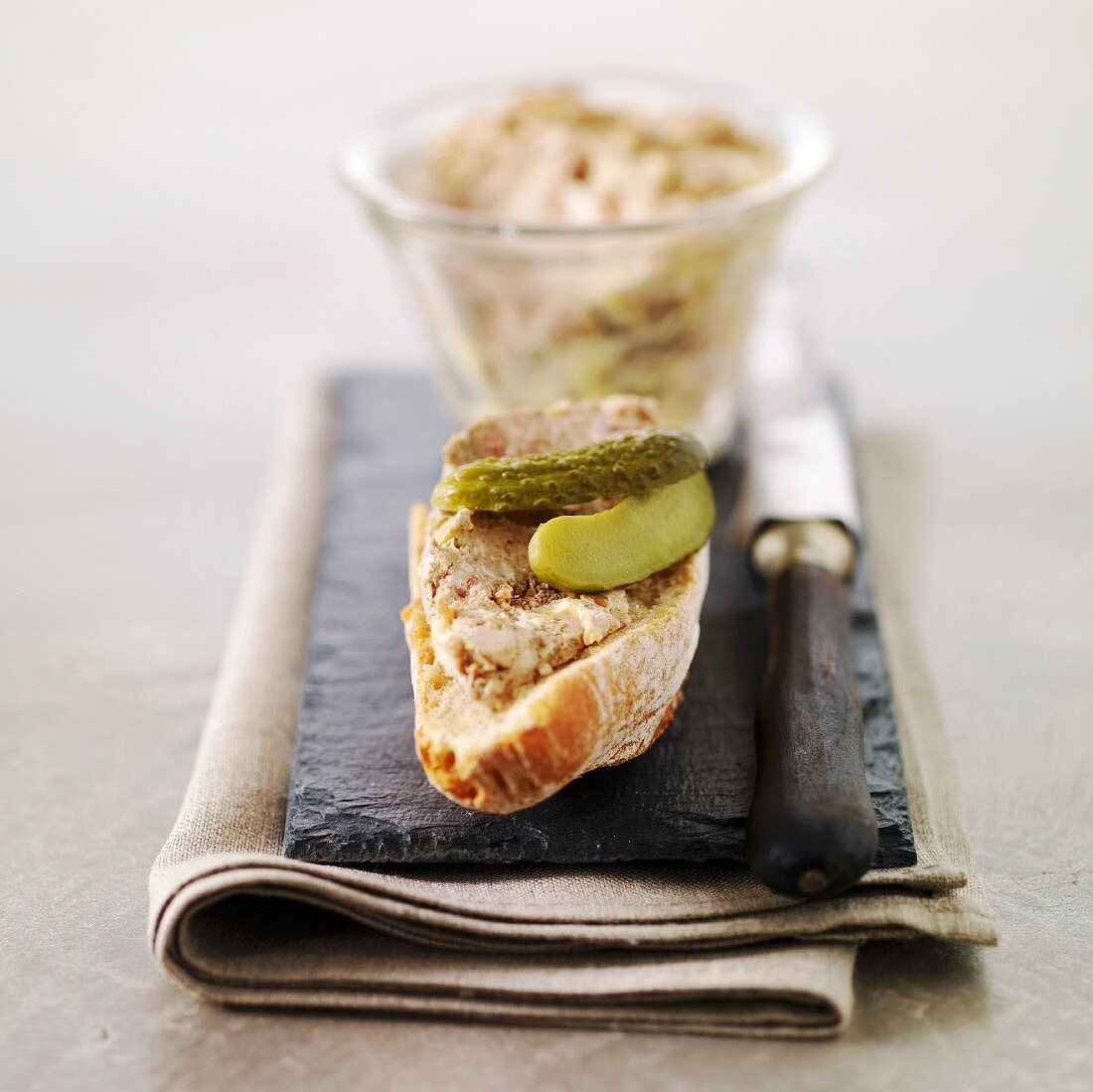 Potted pork on sliced bread with gherkins