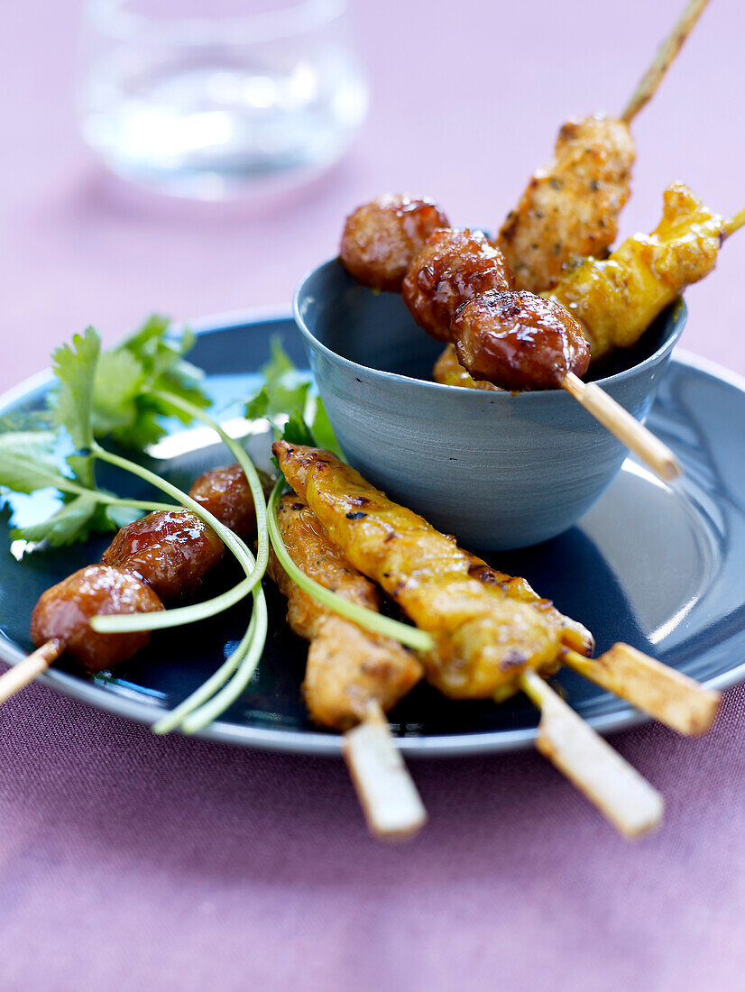 Spicy chicken and beef brochettes