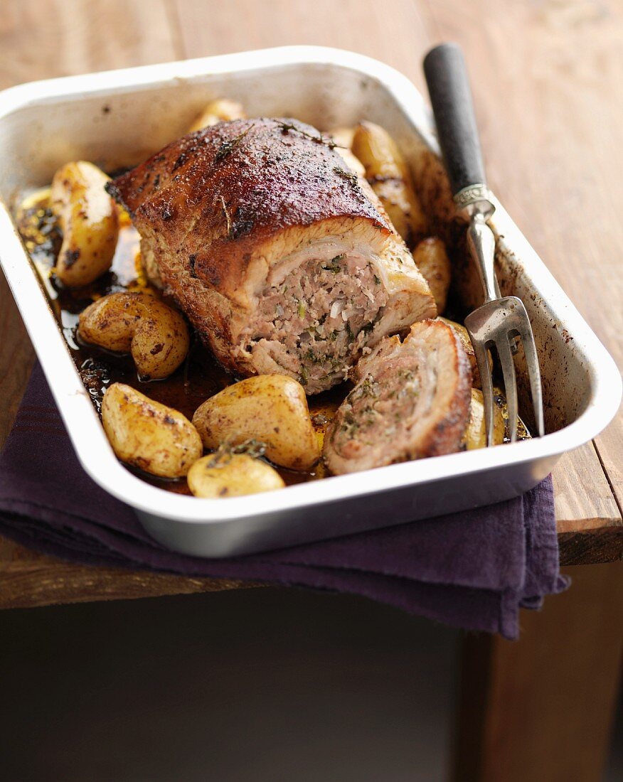 Roast stuffed veal's breast with potatoes