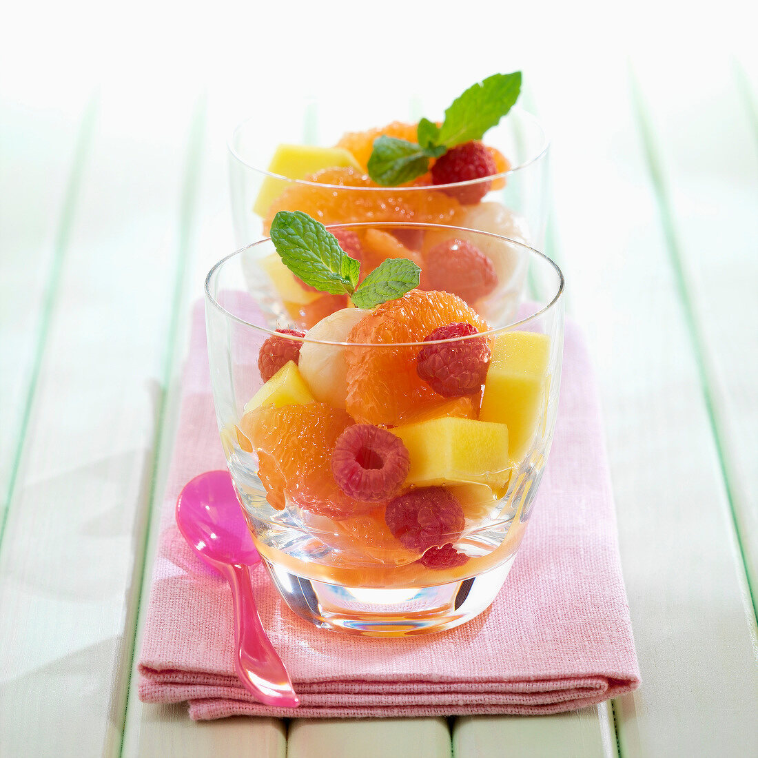 Grapefruit,lychee,raspberry and mango fruit salad with honey