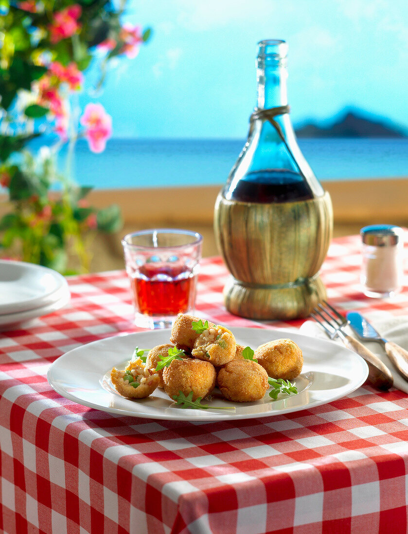 Rice and pea Croquettes on a terrace in Sicily