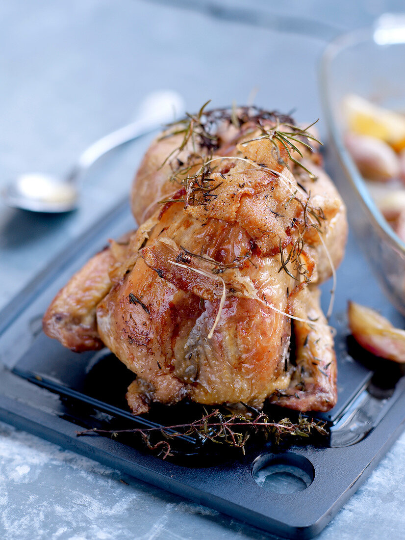 Roast guinea-fowl with bacon and herbs