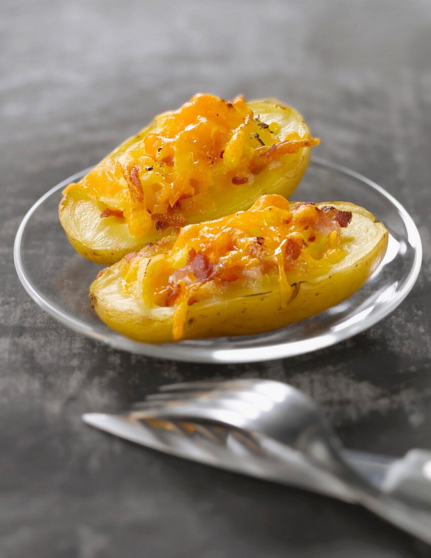 Baked potatoes stuffed with cheddar cheese and bacon