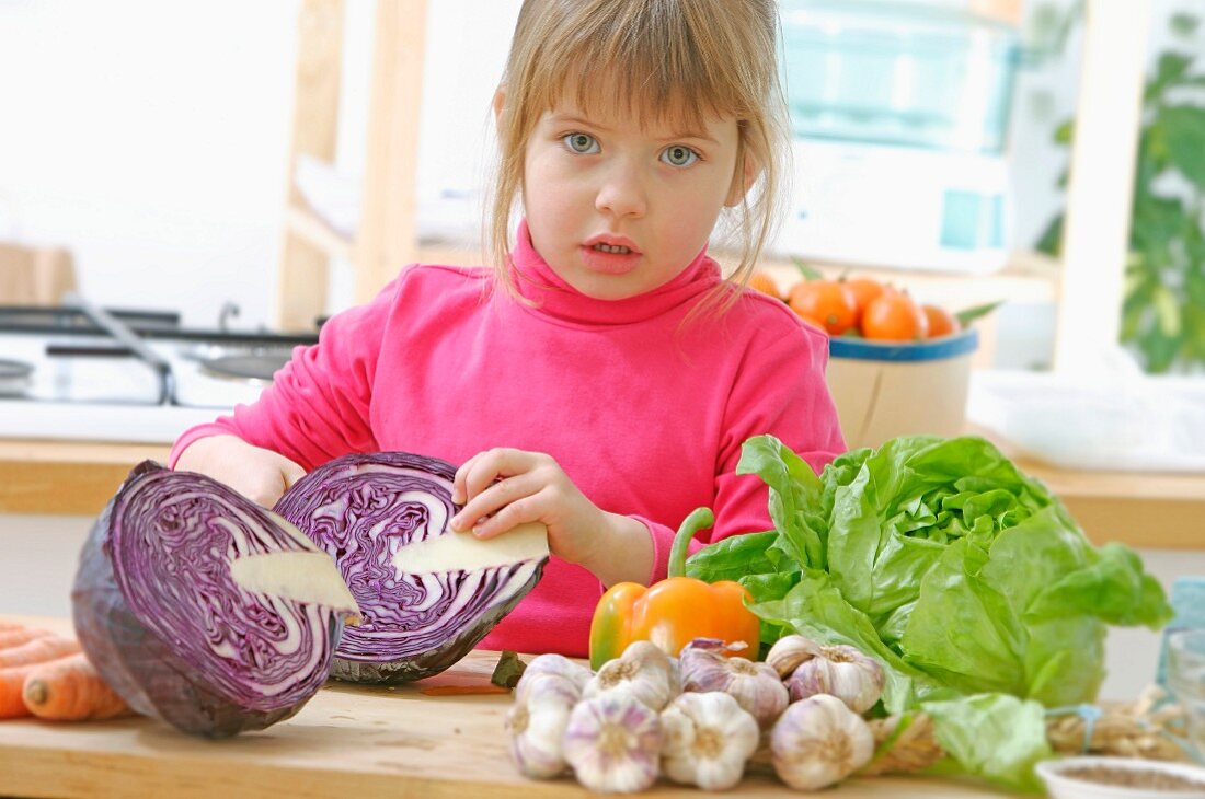 Young girl preparing vegetables