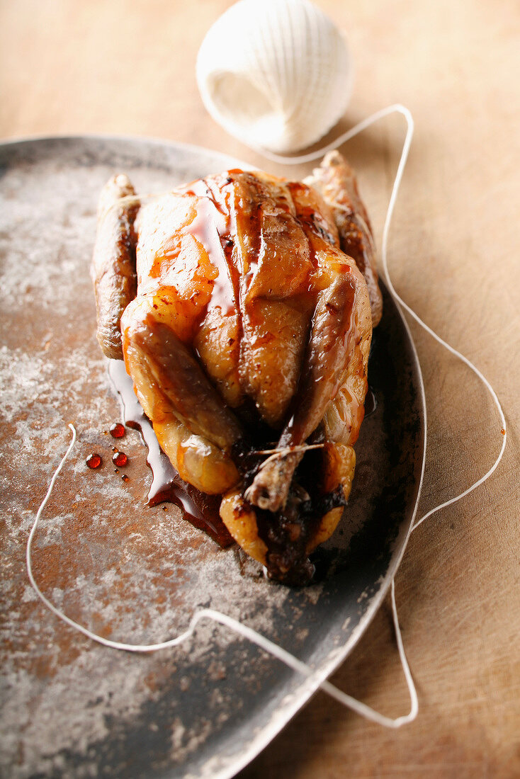 Pigeon cooked with honey and walnuts