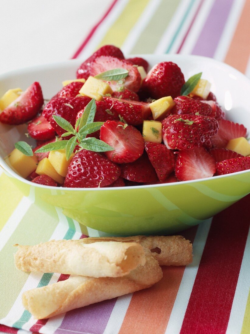 Strawberry and mango fruit salad with fresh verbana