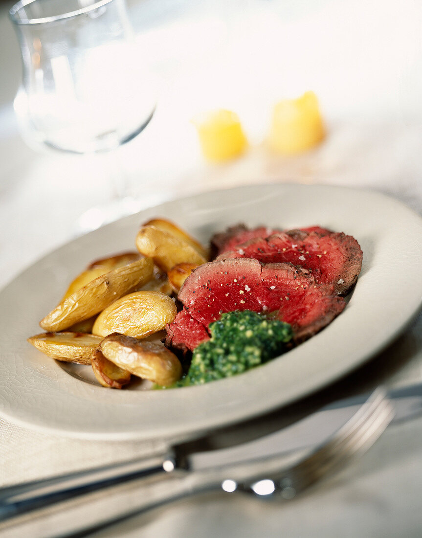 Roast beef with parsley butter and potatoes