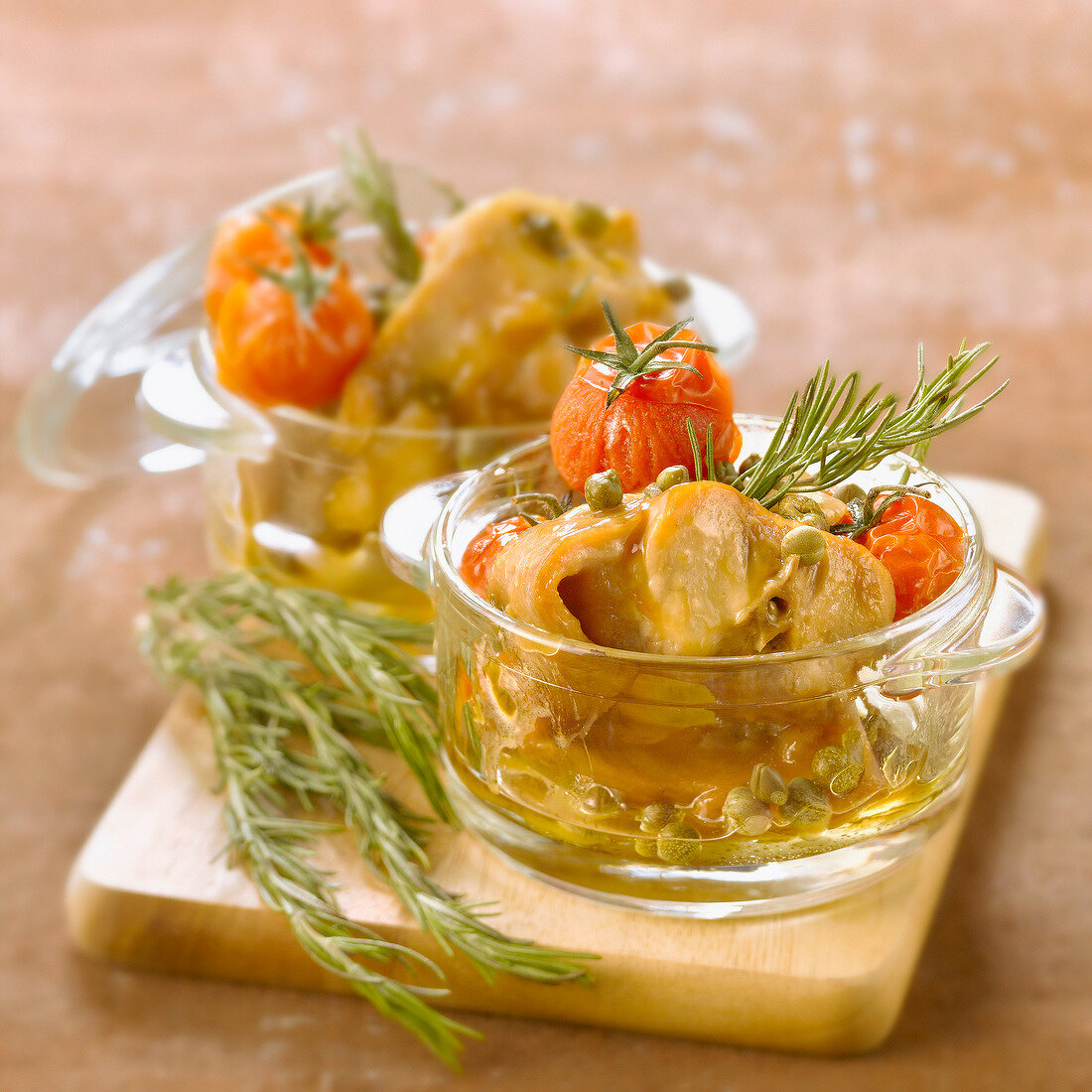 Rabbit stewed with tomatoes,capers and rosemary