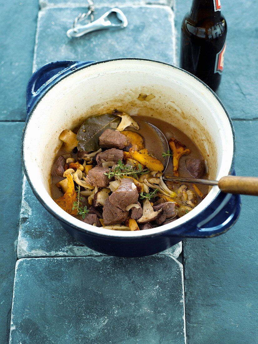 Wild boar stew with beer and mushrooms