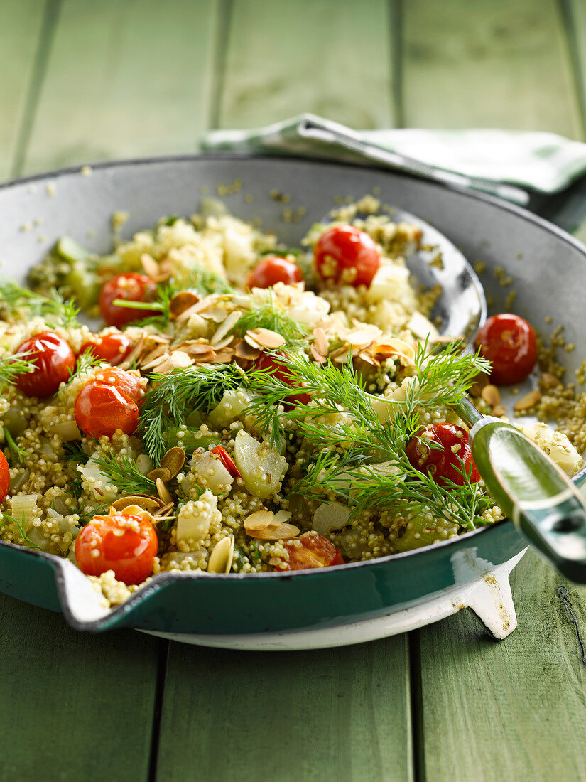 Quinoa with cherry tomatoes,celery stalks,thinly sliced almonds and dill
