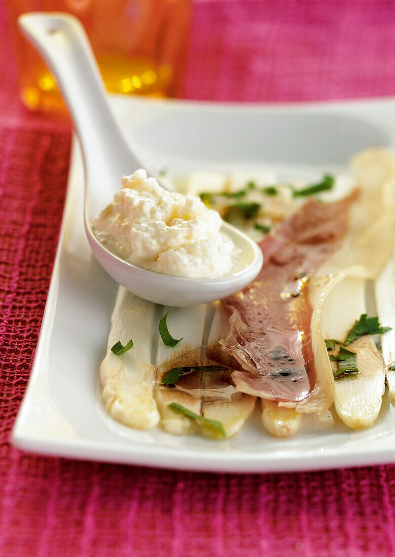 White asparagus carpaccio with raw ham and asparagus mousse