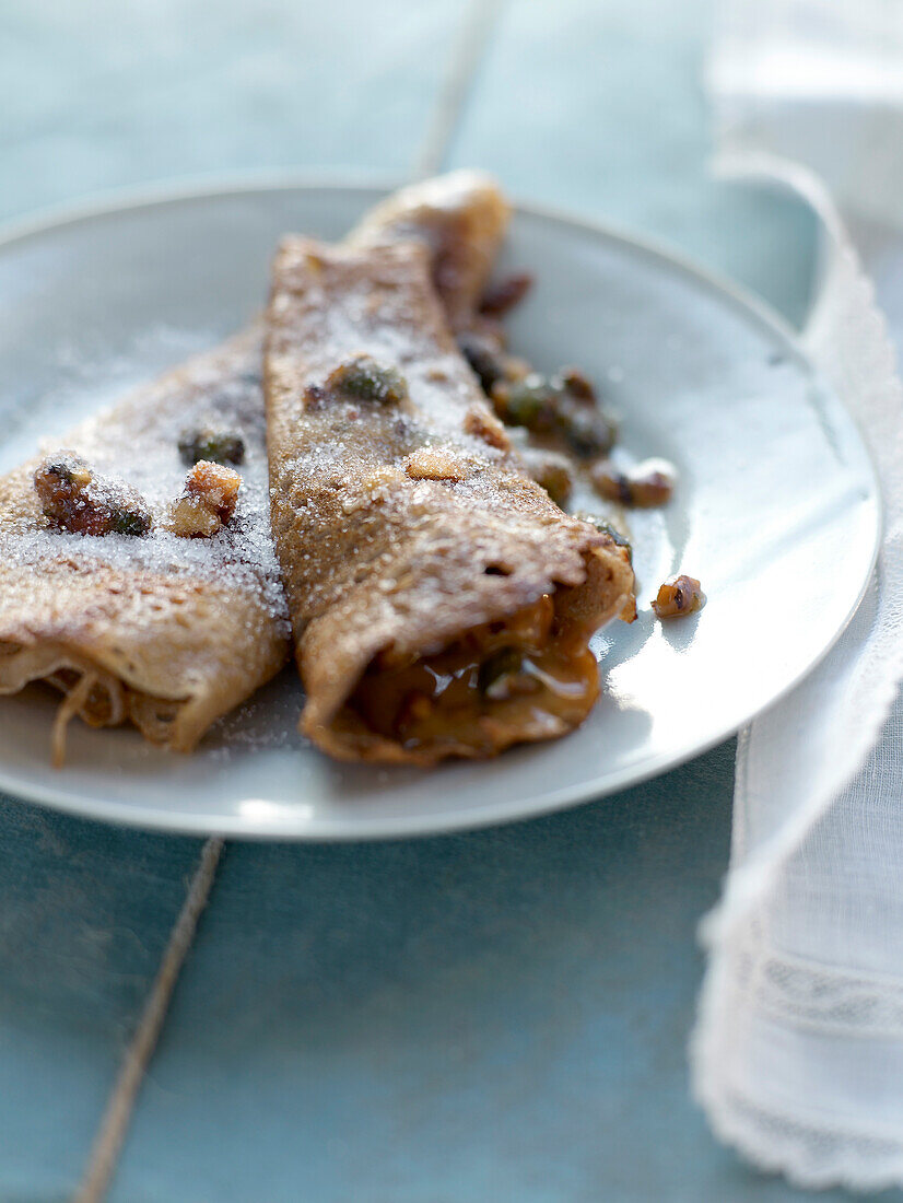 Pancake with dried fruit and maple syrup
