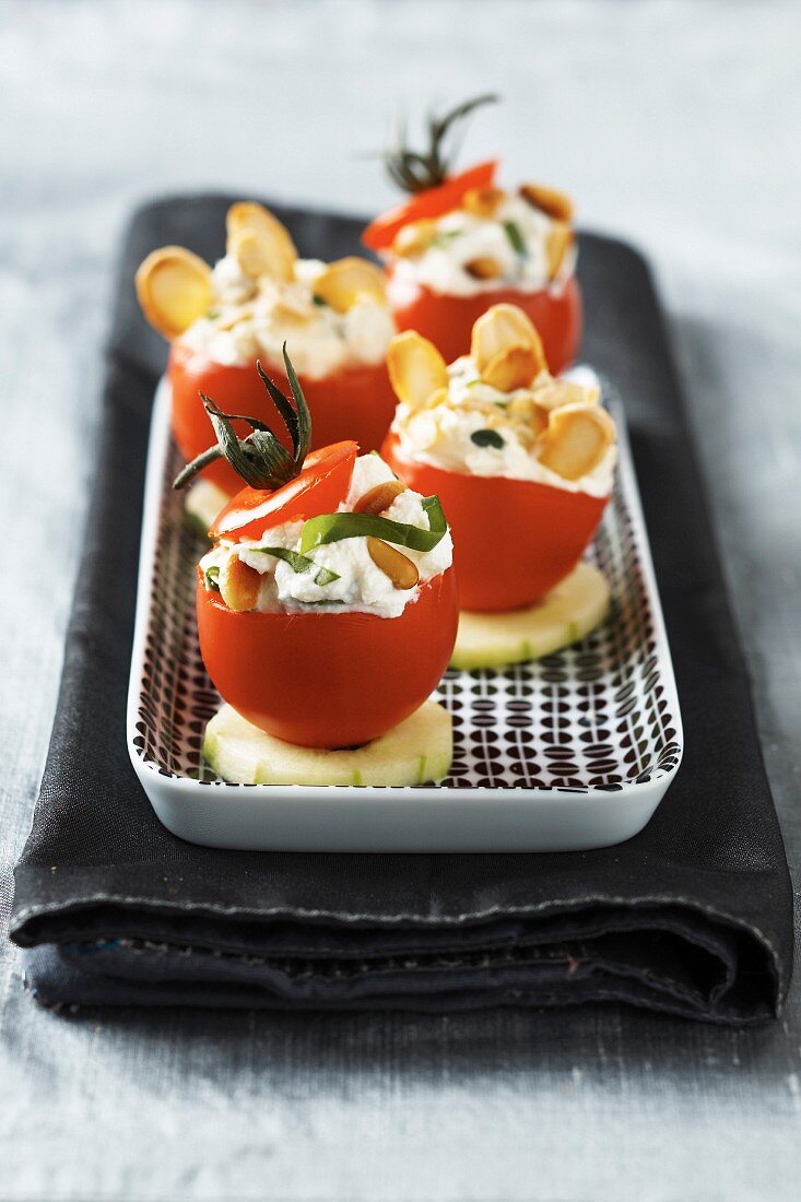 Cherry tomato stuffed with cream cheese and dried fruit