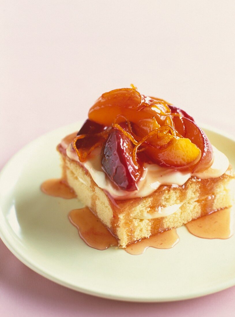 A cake with cream and nectarines