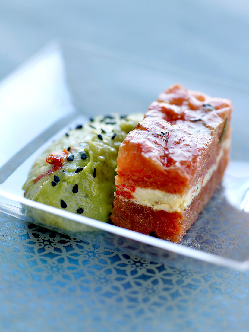 Stewed tomato and cream cheese terrine ,guacamole with black sesame seeds