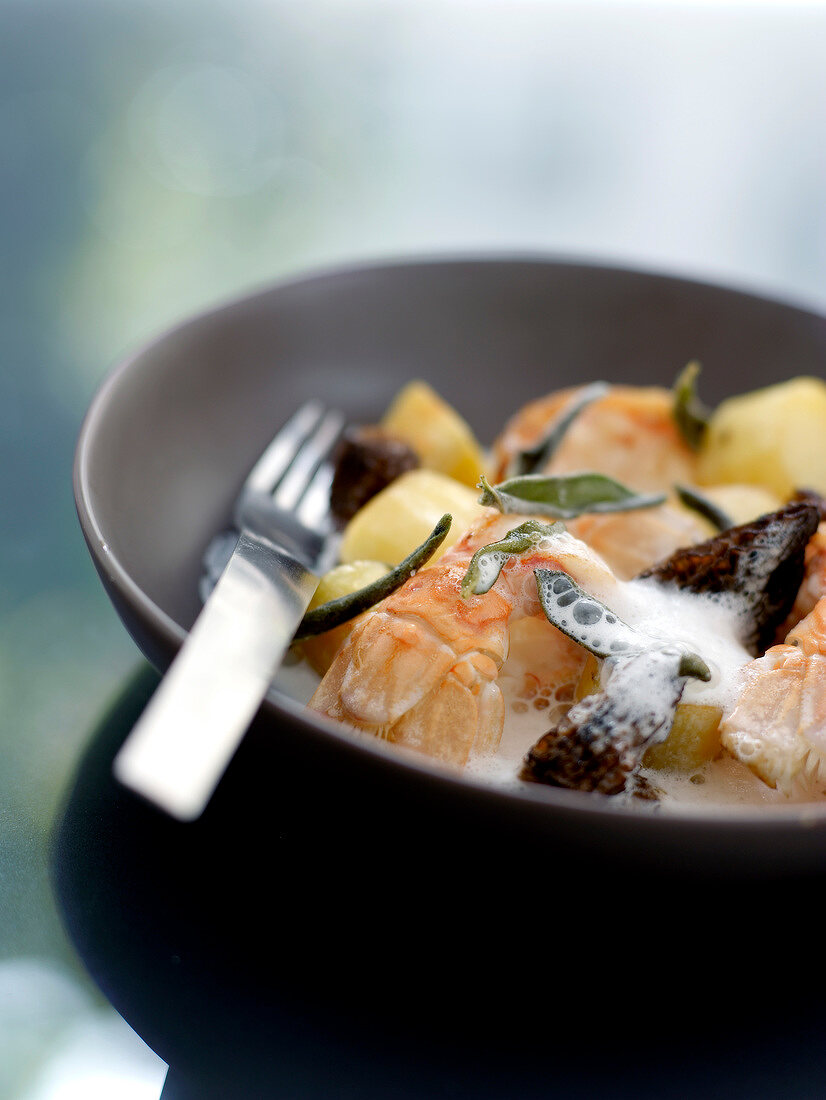 Pan-fried Dublin Bay prawns with potatoes and morels