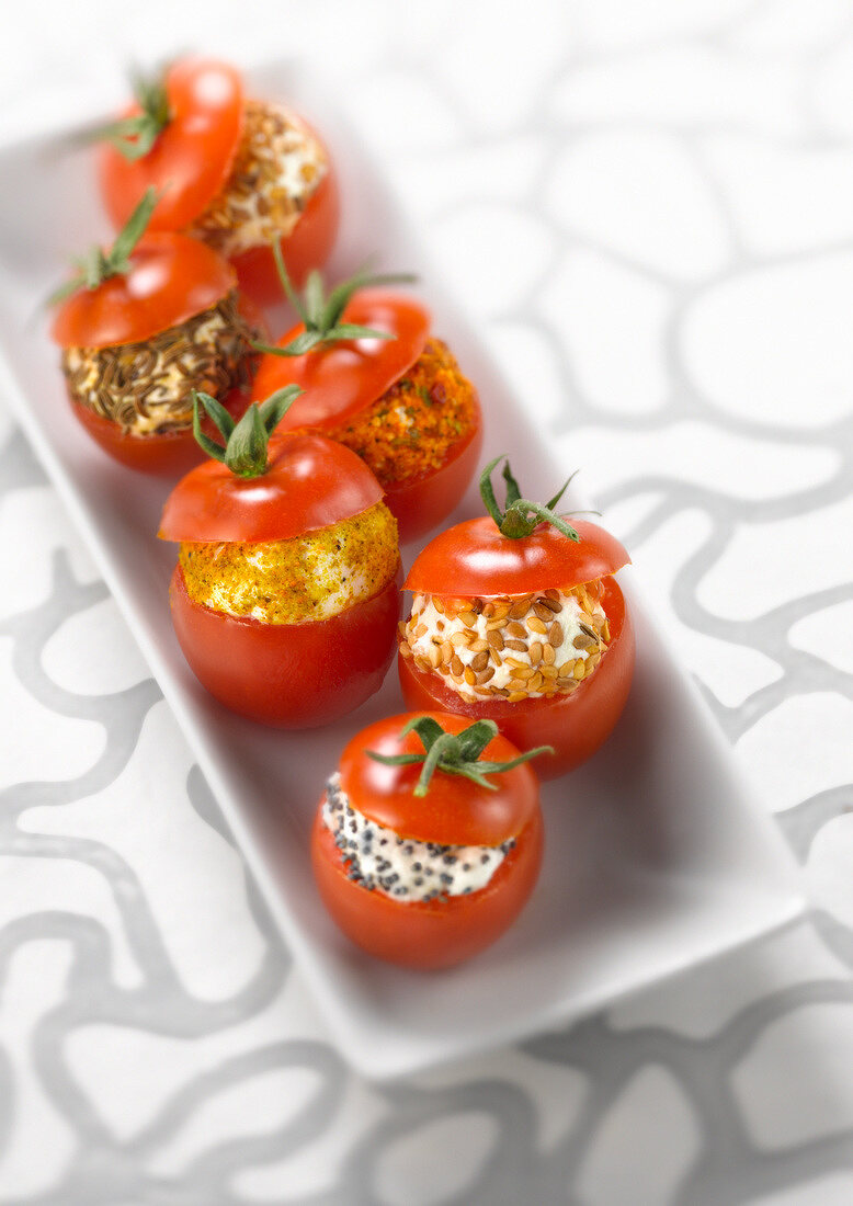 Cherry tomatoes stuffed with spicy goat's cheese