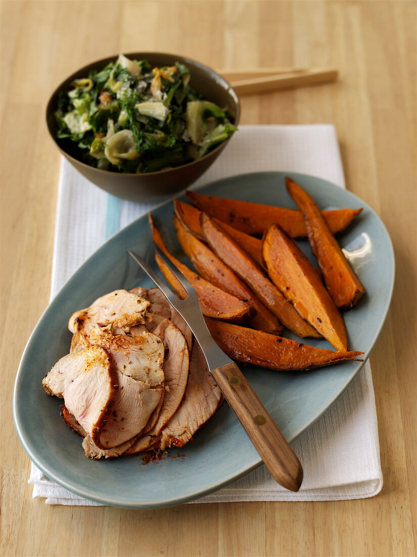 Roast pork with sweet potatoes and stewed swiss chard