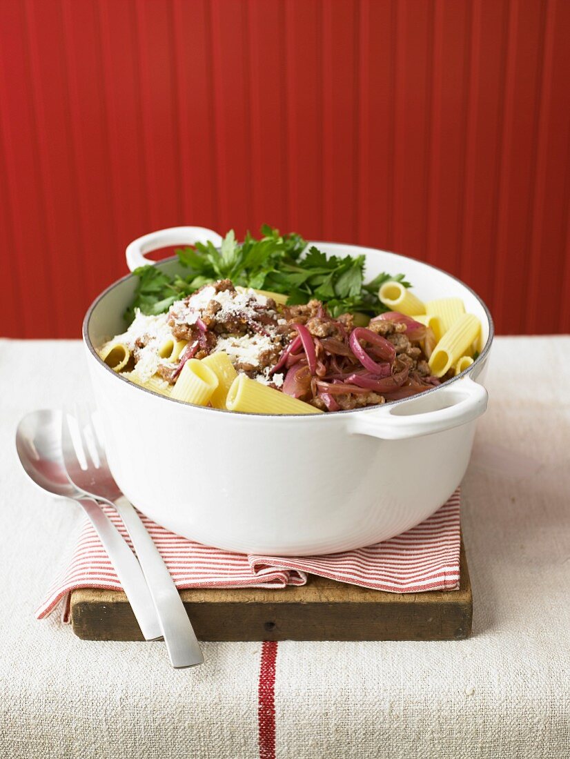 Tubettis with meat, red onions, cheese and coriander in a casserole dish