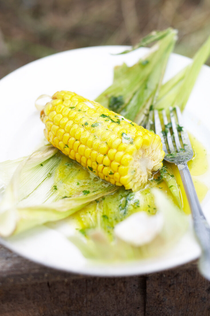 Corn on the cob with melted herb butter