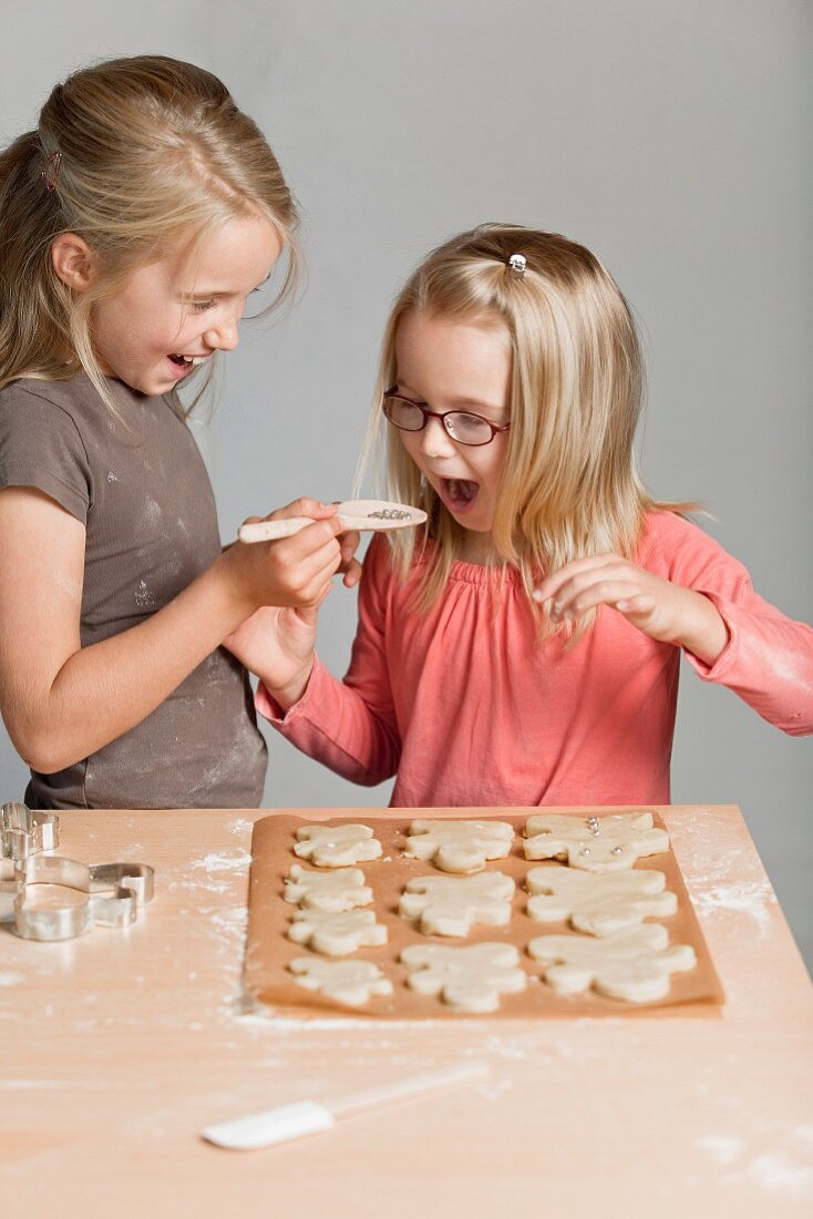 Young girls making cookies