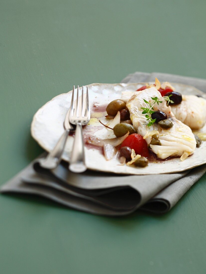 Stockfisch mit Oliven-Kapern-Sauce