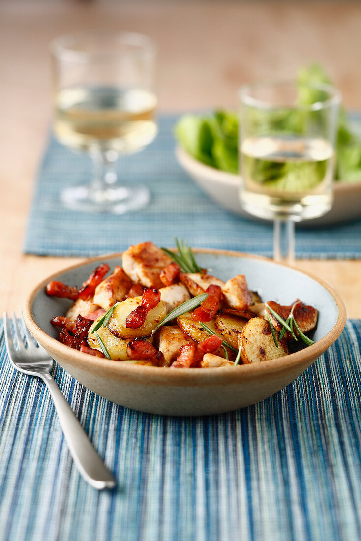 Sauteed potatoes with diced bacon and rosemary