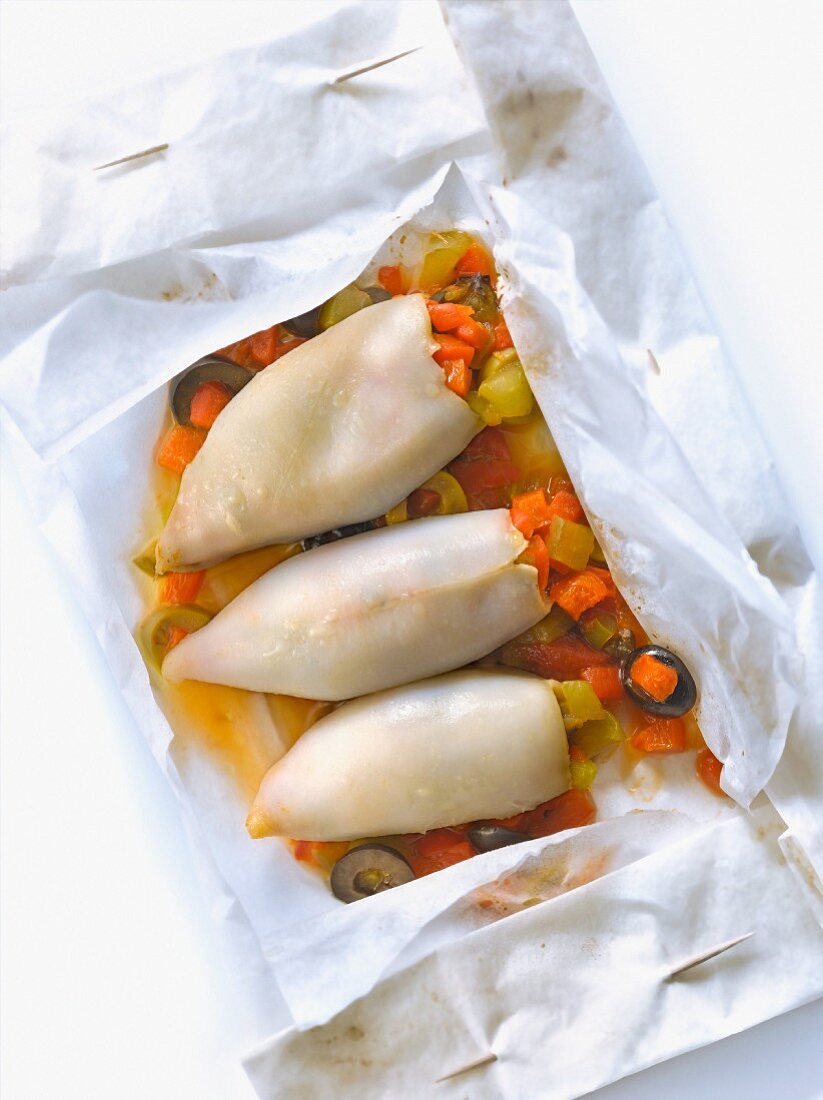 Squid stuffed with Piperade cooked in wax papaer