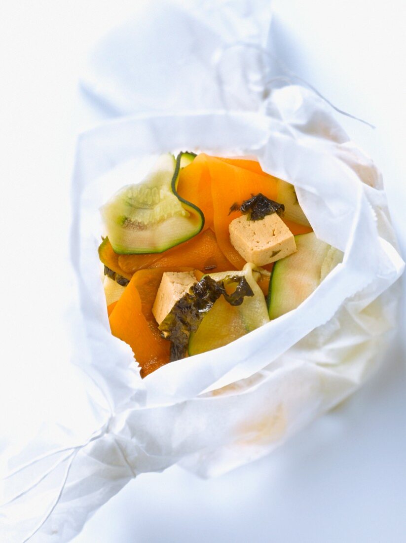 Zucchini,carrot,tofu,seaweed and soya sauce cooked in wax paper