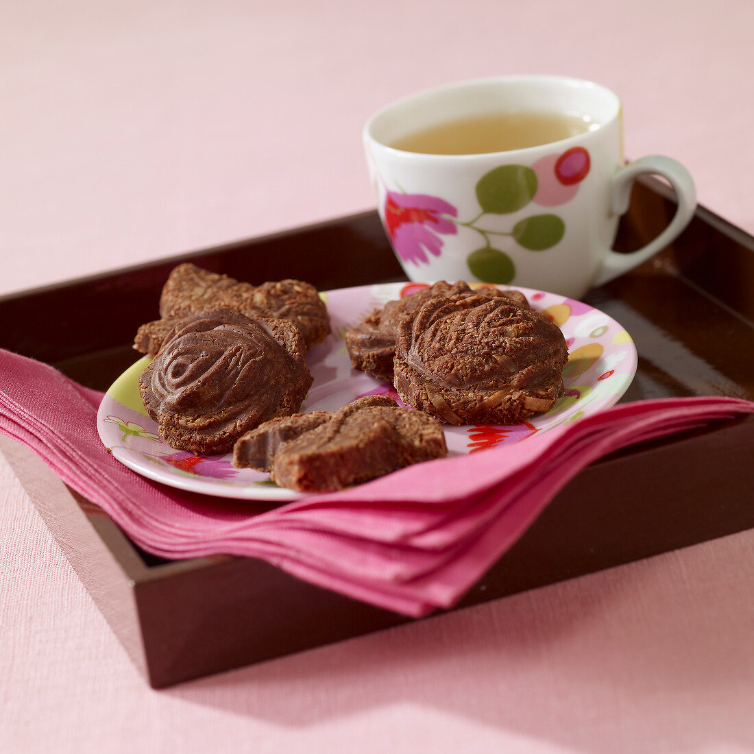 Small chocolate cakes and a cup of tea
