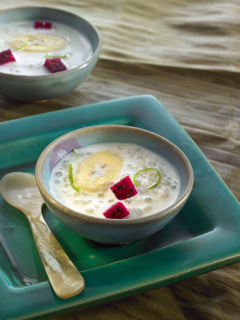 Tapioca and coconut soup with bananas and red pitahaya