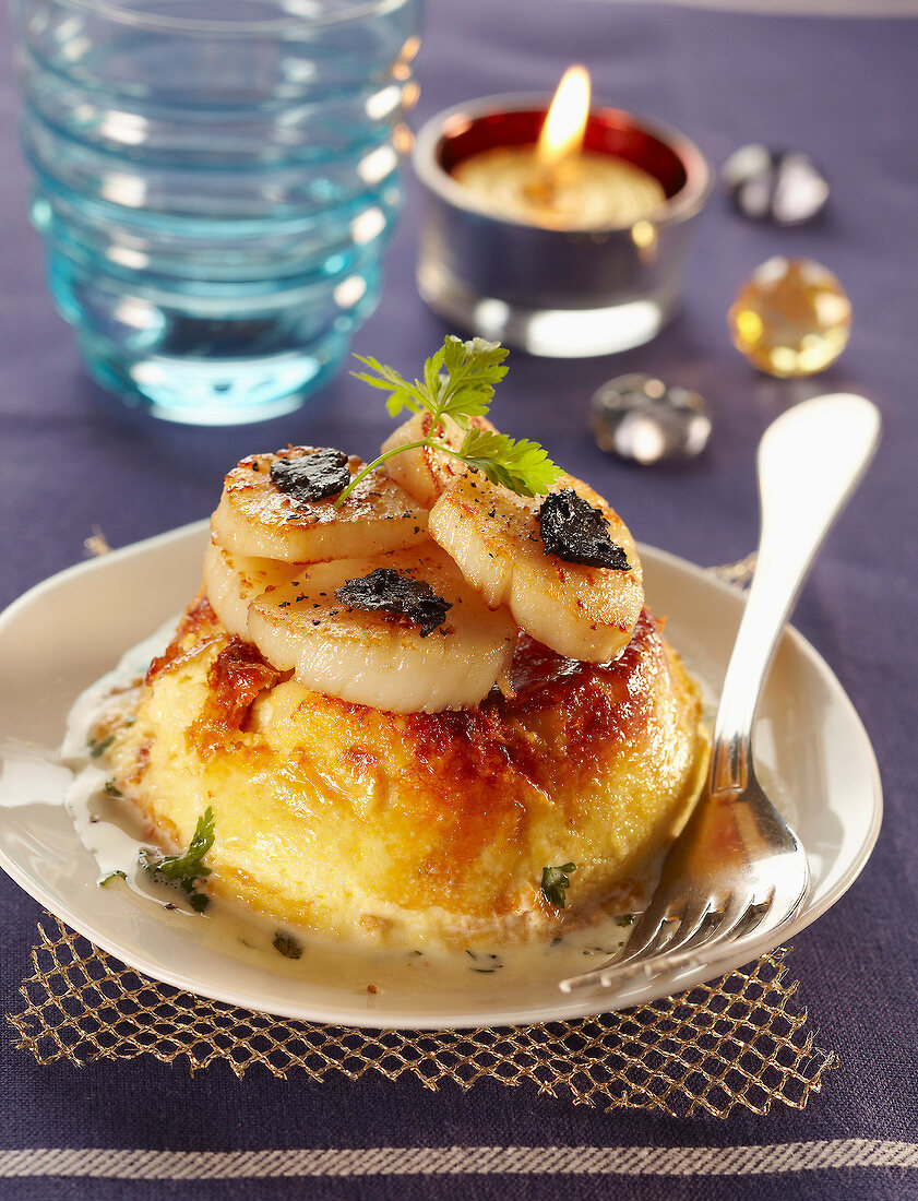Parmesan Flan topped with pan-fried sliced scallops and trufles