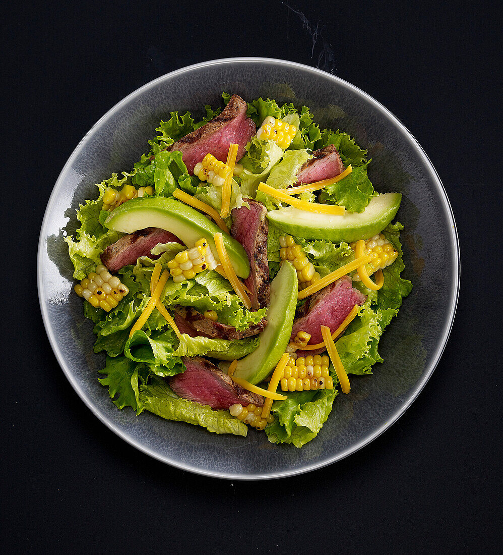 Lettuce,avocado,sweet corn and cold beef salad