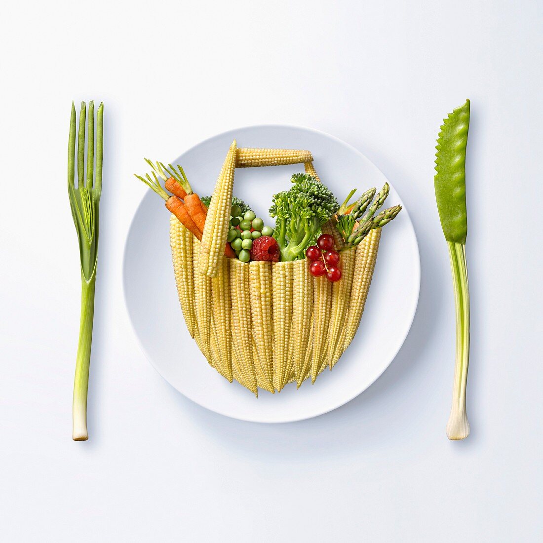 Basket of vegetables from the market made out of vegetables on a plate