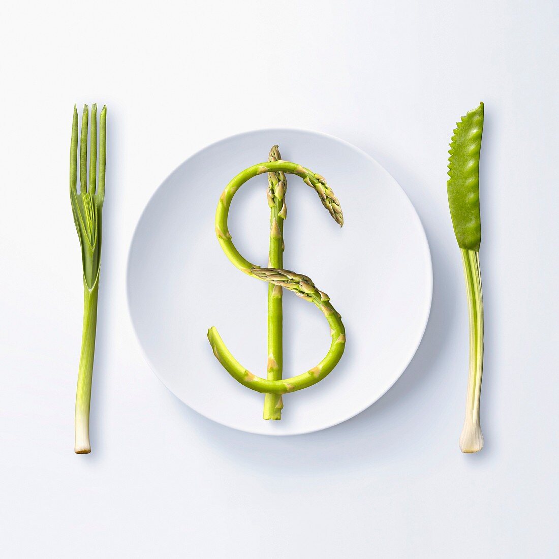 $, written with green asparagus on a plate